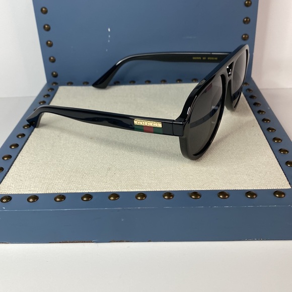 GUCCI GG0767S aviator sunglass comes in a shiny black frame with grey lenses. - Picture 6 of 14